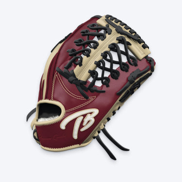 Side view of the Tater Modified Trapeze outfield glove showing the laced trapeze web with blonde sixth-finger strip and the TB logo on the wrist strap