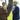 Two men in suits holding baseball bats outdoors, showcasing high-quality equipment for players.