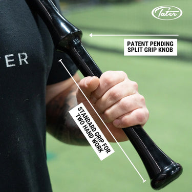 Baseball bat with patent-pending split grip knob for two-hand training, shown in player's grip