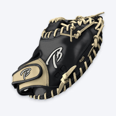 Thumb side of the Tater catcher's mitt showing the white TB logo, blonde wrist pad and laced rim