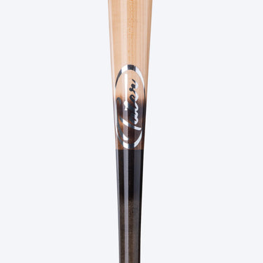 Close-up of the Tater X4 Pro where the natural maple meets the black handle