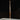 Wood baseball bat with Tater logo, displayed on white surface against dark background